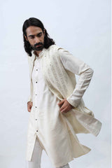 Ivory kurta with Achkan set, paired with mirror dupatta. sasyafashion